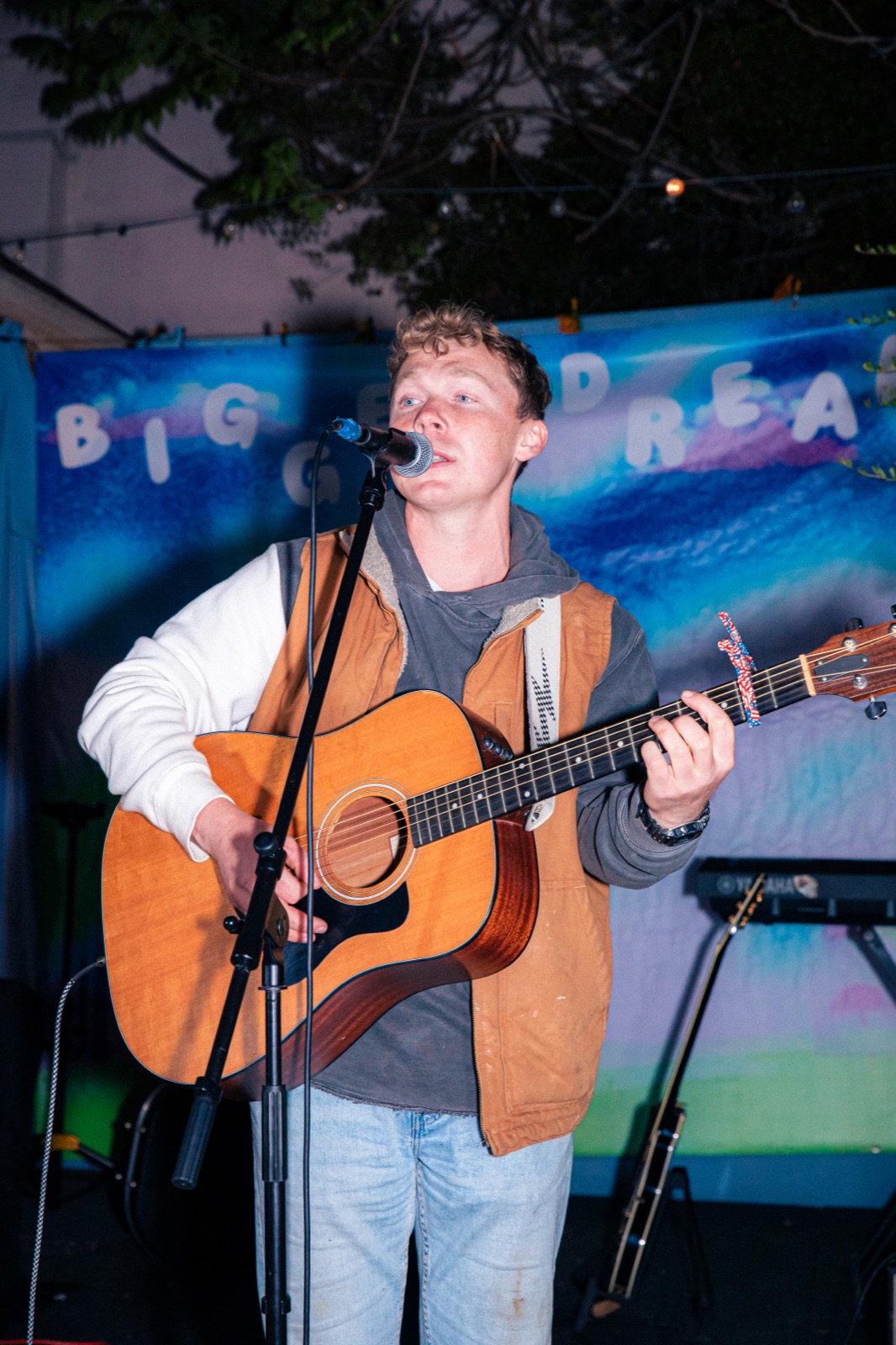 Shawn Chasten singing into a microphone