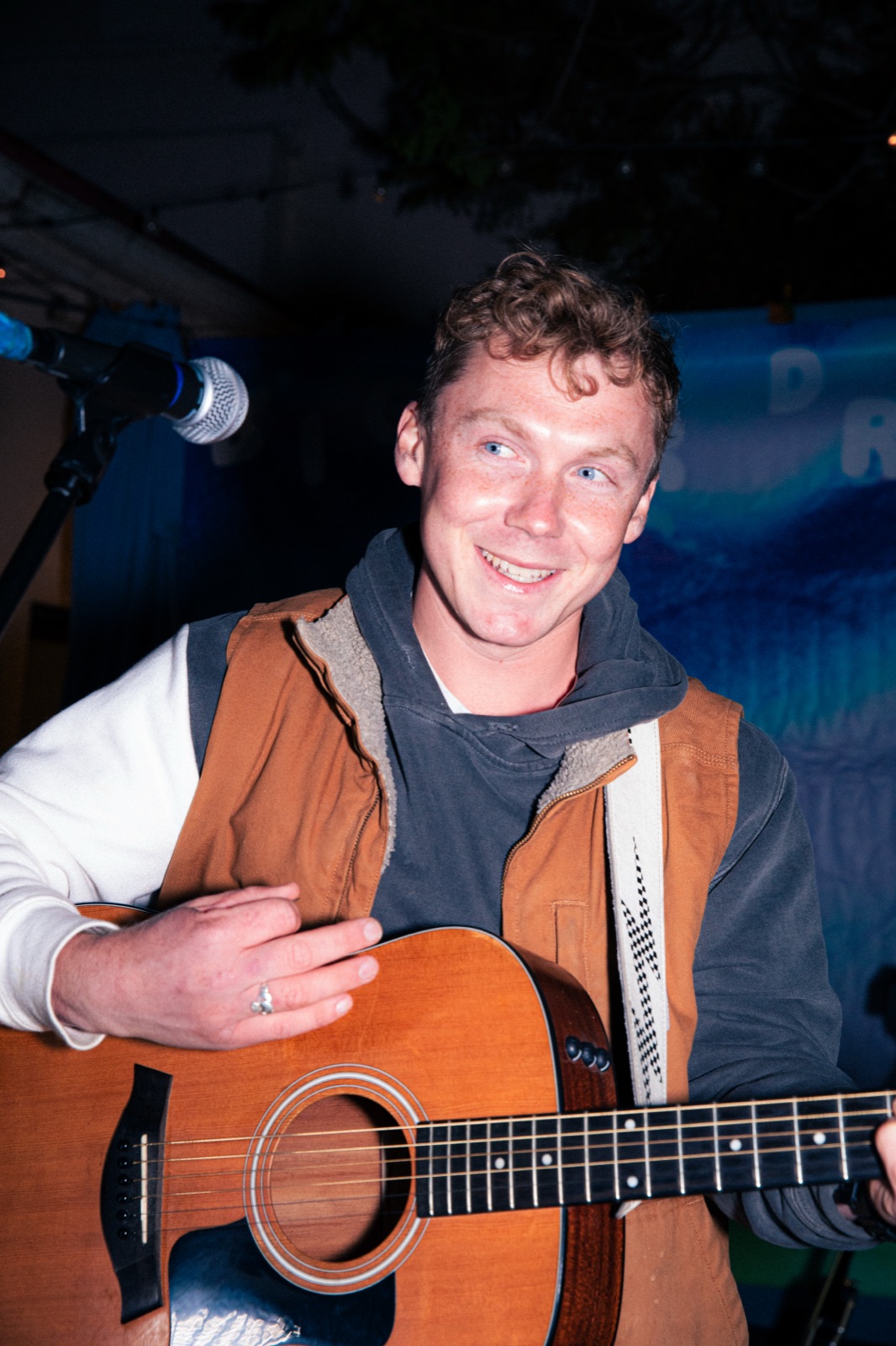 Shawn Chasten with acoustic guitar